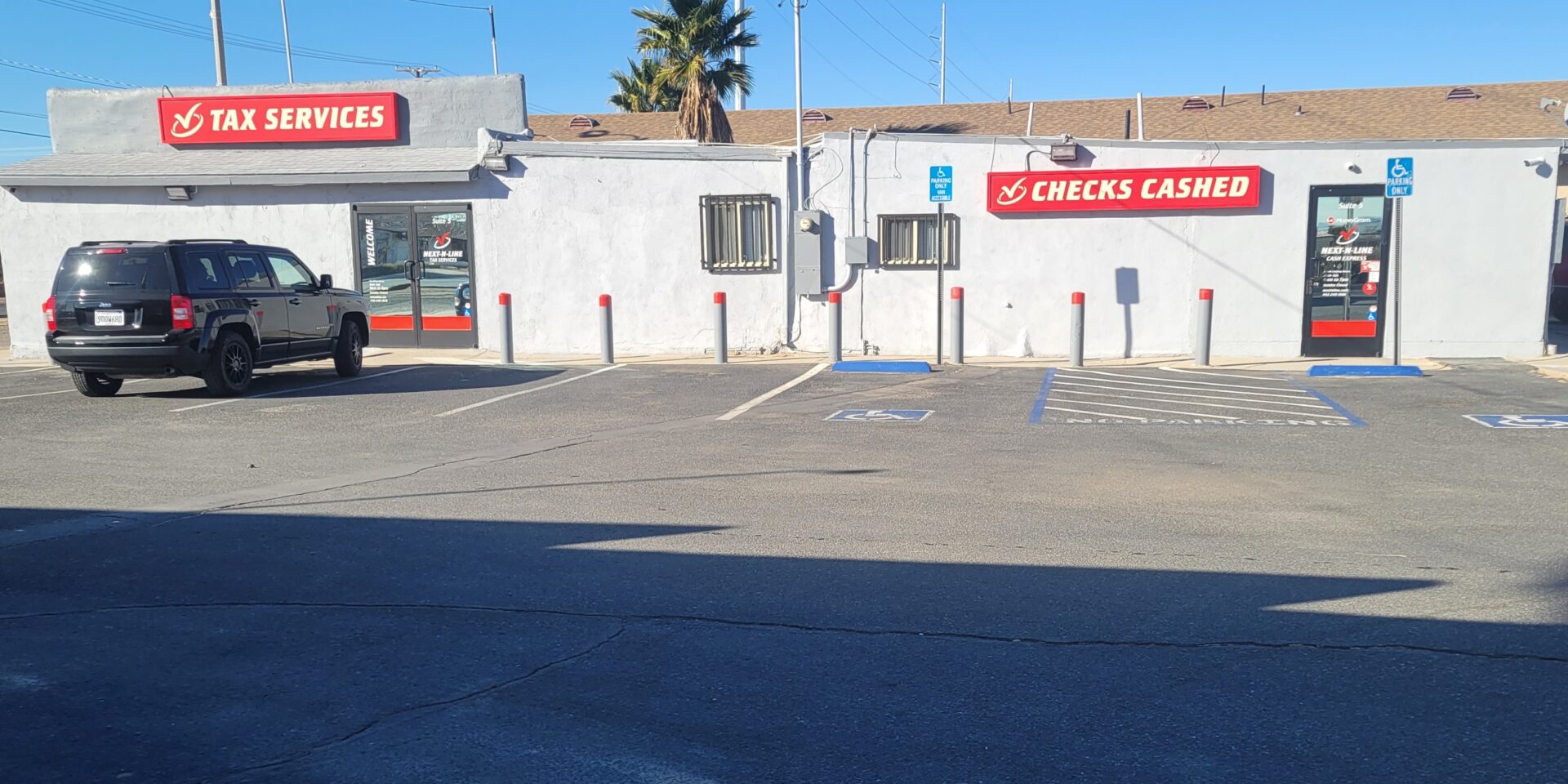 A parking lot with two cars parked in it.